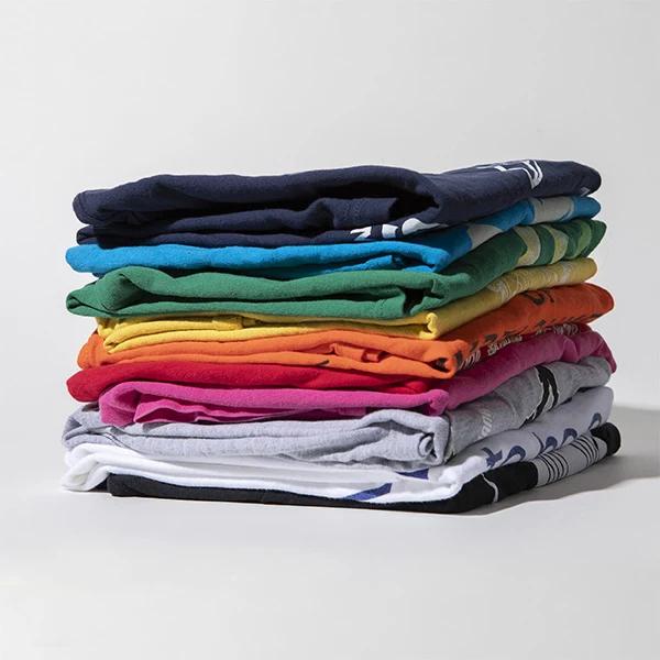 A stack of colorful custom printed t-shirts